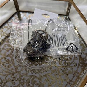 Cleo Bronze Charm Necklace with Floral Accents